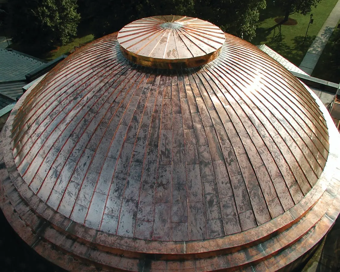 Craftsman Roofing crew installing a new roof in College Manor